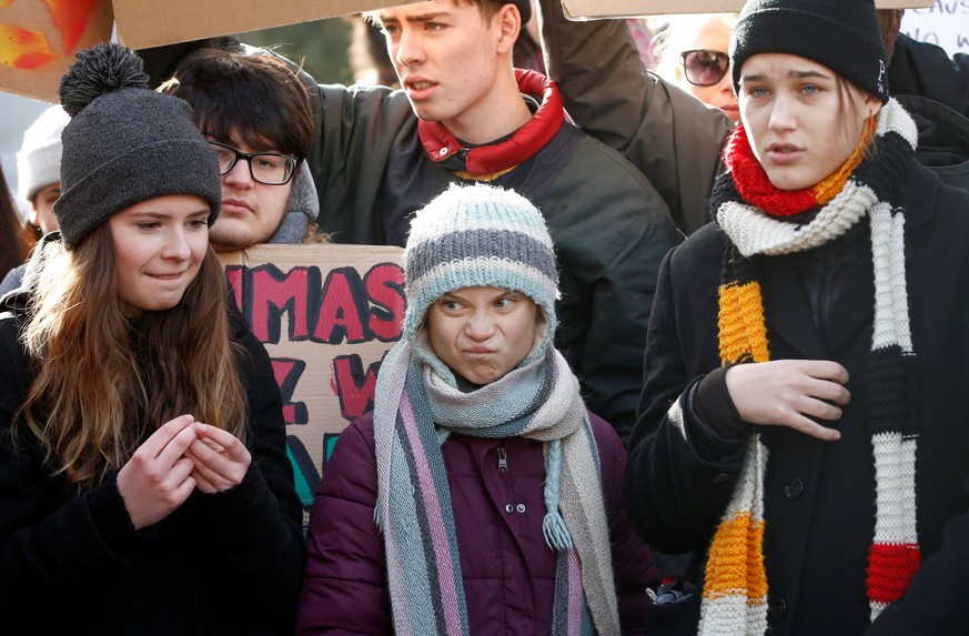 Swedish climate change activist Greta Thunberg, Isabelle Axelsson and German Luisa Neubauer take part in a climate strike protest during the 50th World Economic Forum (WEF) annual meeting in Davos, Sw ...
