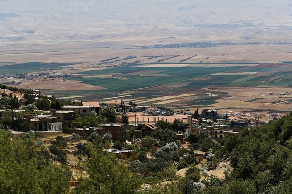 In this Monday, July 23, 2018, photo, a general views shows a part of the Bekaa valley from the village of Deir al Ahmar, 12 kilometers (about 7 miles) northwest of the town of Baalbek in the Bekaa Va ...