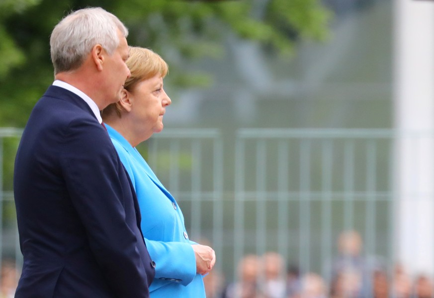 German Chancellor Angela Merkel receives Finland&#039;s new Social Democrat Prime Minister Antti Rinne with military honours at the Chancellery in Berlin, Germany, July 10, 2019. REUTERS/Hannibal Hans ...