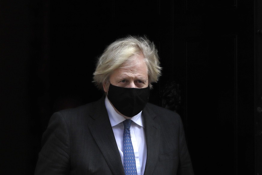 Britain&#039;s Prime Minister Boris Johnson leaves 10 Downing Street to attend the weekly session of Prime Ministers Question&#039;s in parliament in London, Wednesday, Feb. 24, 2021. (AP Photo/Kirsty ...