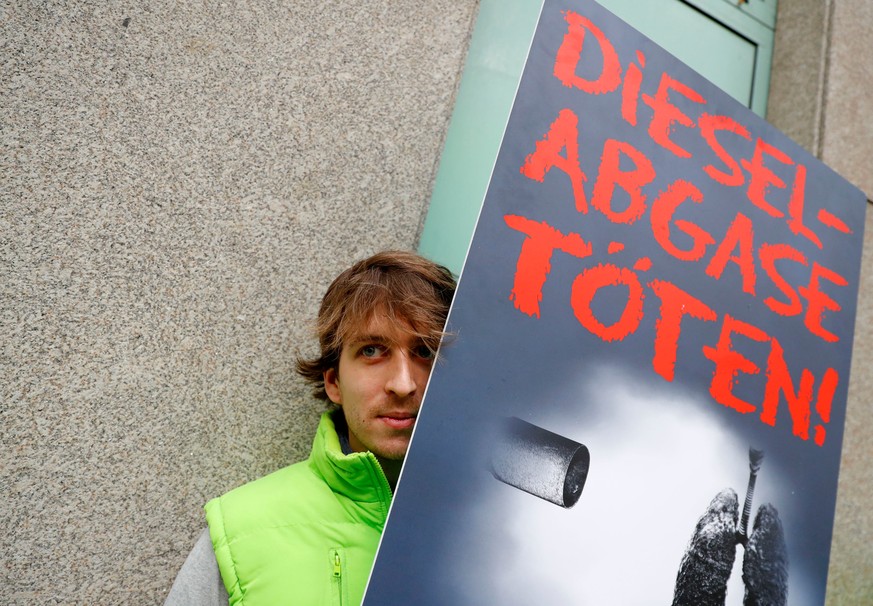 An environmental activist protests in front of a court before a court hearing on case seeking diesel cars ban in Berlin, Germany, October 9, 2018. The sign reads &#039;Diesel exhaust gases kill.&#039; ...