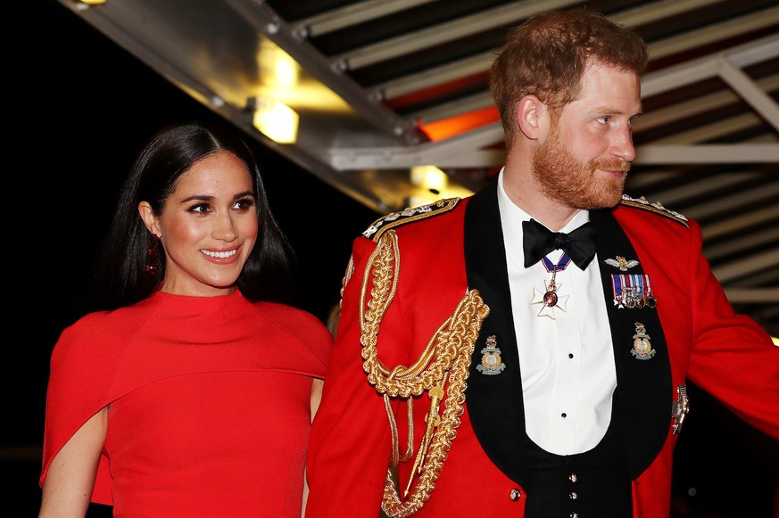 FILE PHOTO: Britain&#039;s Prince Harry and his wife Meghan, arrive to attend the Mountbatten Festival of Music at the Royal Albert Hall in London, Britain March 7, 2020. REUTERS/Simon Dawson/Pool/Fil ...
