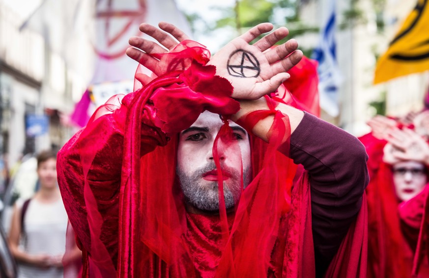 September 20, 2019, Munich, Bavaria, Germany: Members of the Extinction Rebellion activist group held performing art demonstrations during the Global Climate Strike in Munich, Germany. Joining hundred ...