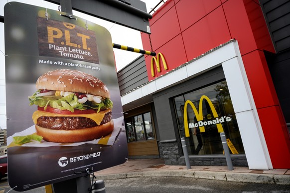 FILE PHOTO: A sign promoting McDonald&#039;s &quot;PLT&quot; burger with a Beyond Meat plant-based patty at one of 28 test restaurant locations in Ontario, Canada October 2, 2019. REUTERS/Moe Doiron/F ...