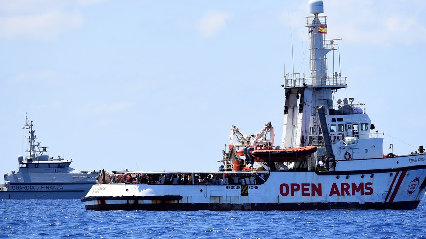 Spanish migrant rescue ship Open Arms is seen close to the Italian shore in Lampedusa, Italy August 16, 2019. REUTERS/Guglielmo Mangiapane