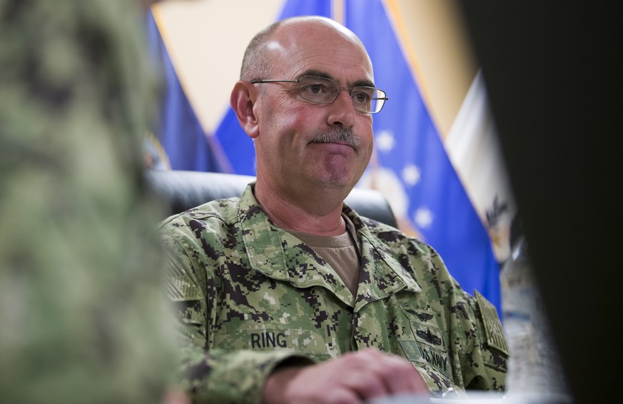 In this photo reviewed by U.S. military officials, U.S. Navy Rear Adm. John Ring, Joint Task Force Guantanamo Commander, pauses while speaking during a roundtable discussion with the media, Wednesday, ...