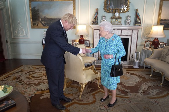 Brexit. File photo dated 24/07/19 of Queen Elizabeth II inviting Boris Johnson to become Prime Minister and form a new government during an audience in Buckingham Palace. Mr Johnson will seek an exten ...