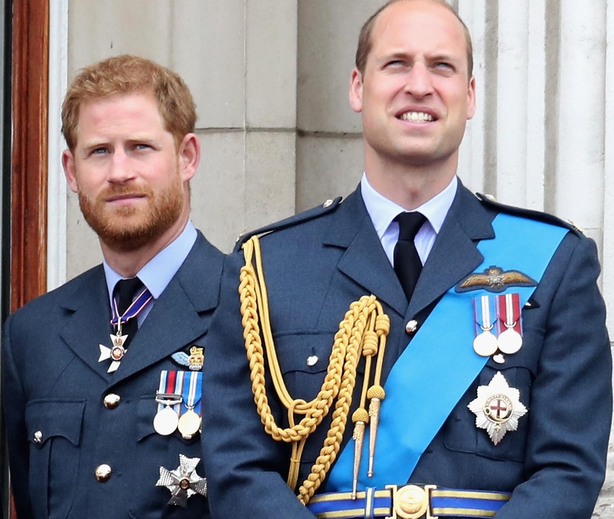 LONDON, ENGLAND - JULY 10: (L-R) Prince William, Duke of Cambridge and Prince Harry, Duke of Sussex watch the RAF flypast on the balcony of Buckingham Palace, as members of the Royal Family attend eve ...