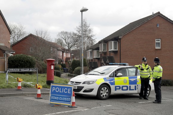 FILE - In this Tuesday, March 13, 2018 file photo, police offices cordon off the road of the residence of former Russian double agent Sergei Skripal in Salisbury, England. Police officers from 40 depa ...
