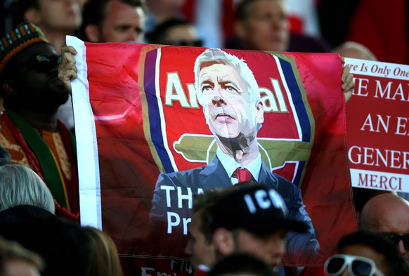 Huddersfield Town v Arsenal - Premier League - John Smith s Stadium Arsenal fans in the stands hold up a banner honouring outgoing manager Arsene Wenger EDITORIAL USE ONLY No use with unauthorised aud ...