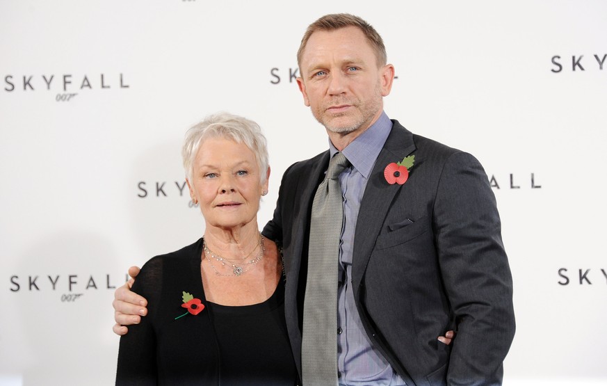 LONDON, UNITED KINGDOM - NOVEMBER 03: Dame Judi Dench and Daniel Craig attend a photocall with cast and filmmakers to mark the start of production which is due to commence on the 23rd Bond Film &#039; ...