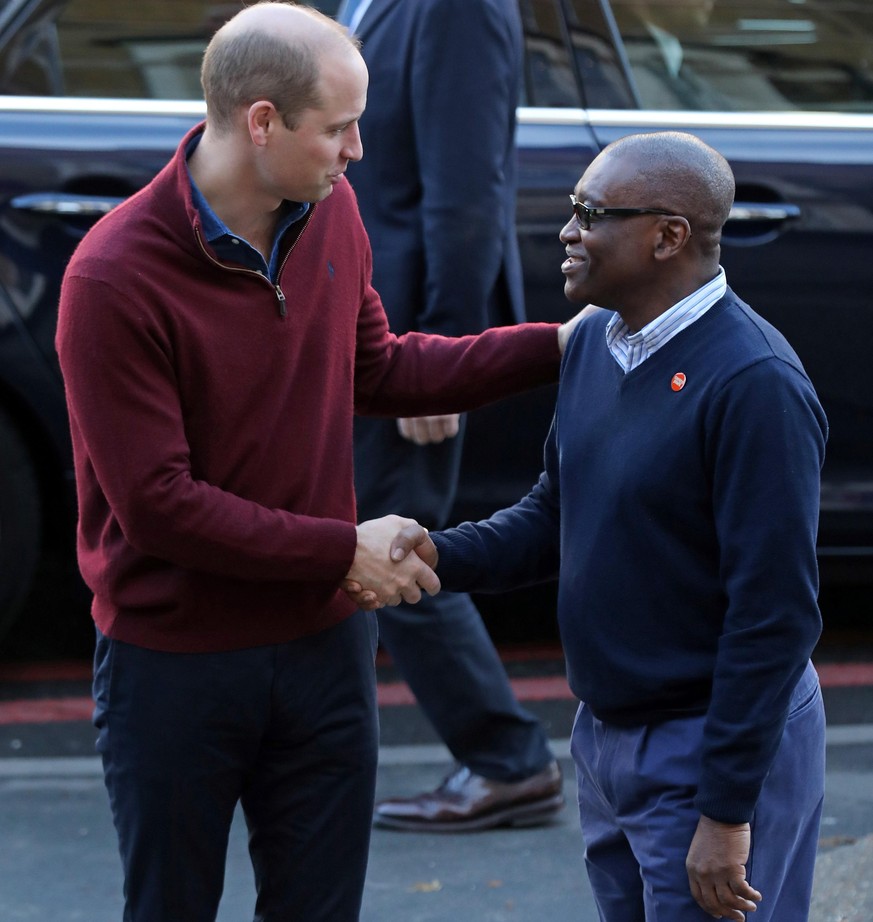 . 13/11/2019. London, United Kingdom. Britain s Prince William, Duke of Cambridge s greeted by CEO of Centrepoint, Seyi Obakin, during a visit to Centrepoint s new Apprenticeship House in London to ma ...
