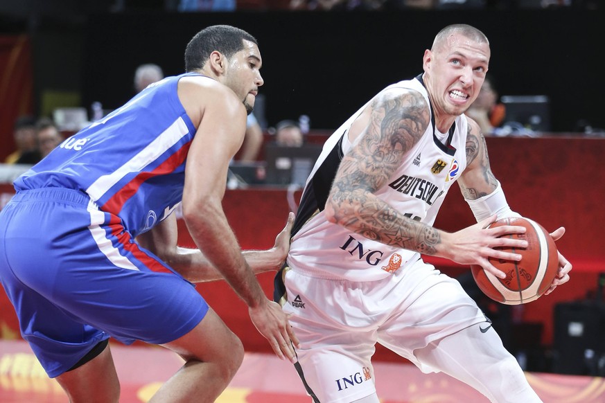 SHENZHEN, CHINA - SEPTEMBER 03: Daniel Theis 10 of Germany and Eloy Vargas 11 of Dominican Republic fight for the ball during FIBA WM World Cup 2019 Group G match between Germany and Dominican Republi ...