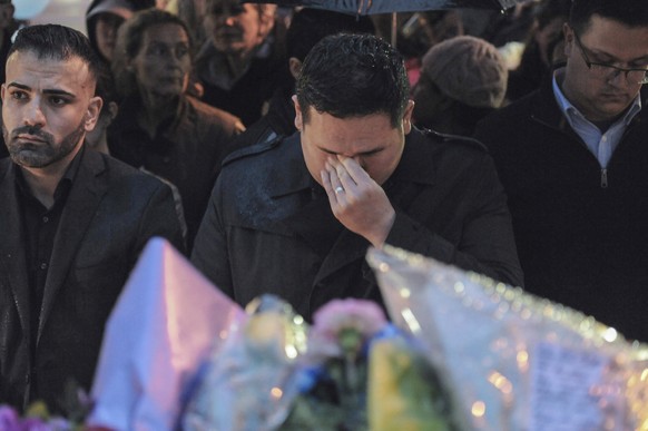 A man wipes his tears at a vigil on Yonge Street in Toronto, Tuesday, April 24, 2018. Ten people were killed and more than a dozen were injured in Monday&#039;s deadly attack in which a van struck ped ...
