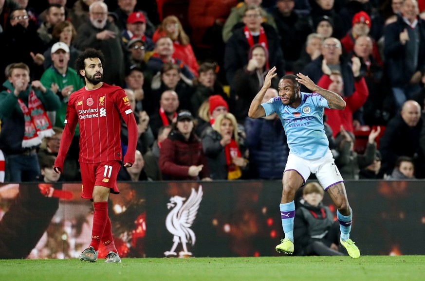Soccer Football - Premier League - Liverpool v Manchester City - Anfield, Liverpool, Britain - November 10, 2019 Manchester City&#039;s Raheem Sterling reacts as Liverpool&#039;s Mohamed Salah looks o ...
