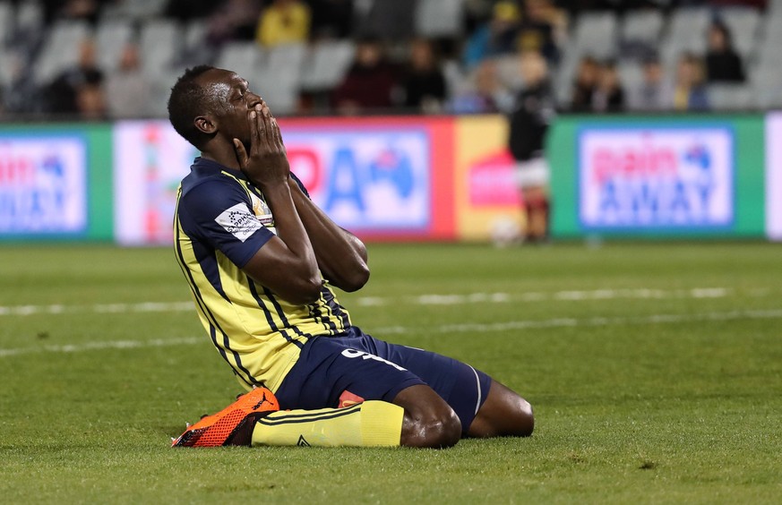 (181012) -- CAMPBELLTOWN, Oct. 12, 2018 -- Jamaican Olympic gold medalist Usain Bolt of Central Coast Mariners celebrates after scoring during a charity football game between Central Coast Mariners an ...