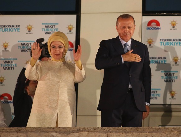 ANKARA, TURKEY - JUNE 25: Turkey&#039;s President Recep Tayyip Erdogan and his wife Emine Erdogan greet supporters gathered in front of the AK Party headquarters on June 25, 2018 in Ankara, Turkey. Mo ...