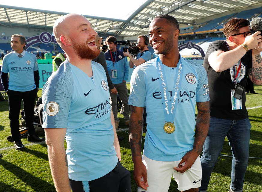 Soccer Football - Premier League - Brighton &amp; Hove Albion v Manchester City - The American Express Community Stadium, Brighton, Britain - May 12, 2019 Manchester City&#039;s Raheem Sterling and ki ...