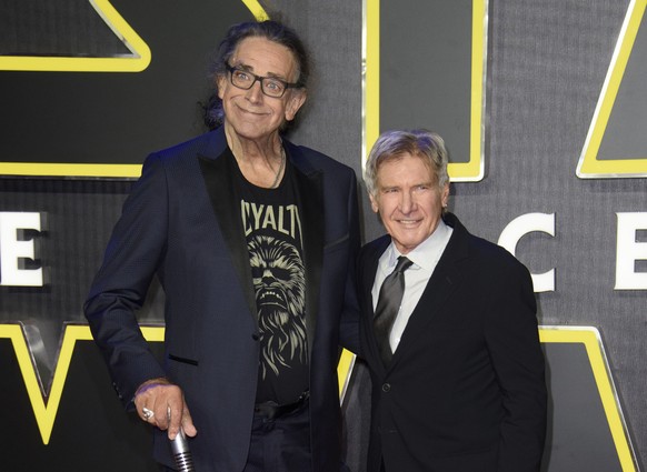 FILE - This Dec. 16, 2015 file photo shows Peter Mayhew, left, and Harrison Ford at the European premiere of the film &#039;Star Wars: The Force Awakens &#039; in London. Mayhew, who played the rugged ...