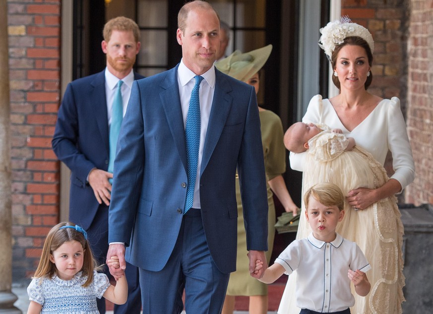 LONDON, ENGLAND - JULY 09: Princess Charlotte and Prince George hold the hands of their father, Prince William, Duke of Cambridge, as they arrive at the Chapel Royal, St James&#039;s Palace, London fo ...