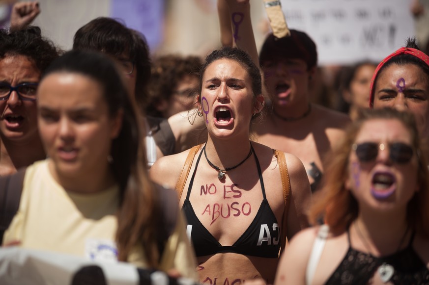 May 10, 2018 - Malaga, Spain - A protester with her body painted with the words: &#039;&#039;It is not abuse, it is rape&#039;&#039; takes part in a demonstration during a feminist student strike agai ...