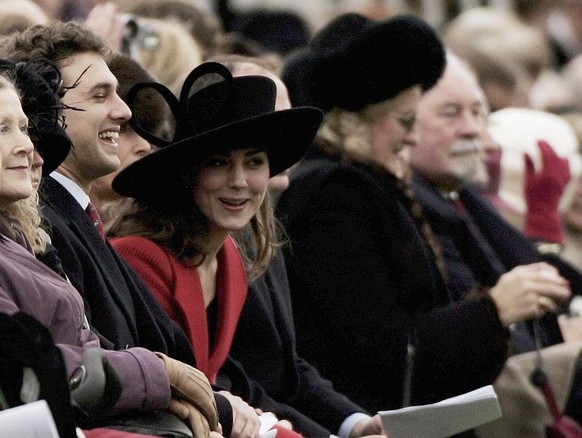 SANDHURST, ENGLAND - DECEMBER 15: HRH Prince William&#039;s girlfriend Kate Middleton (C) smiles while watching William take part in The Sovereign&#039;s Parade at The Royal Military Academy Sandhurst ...