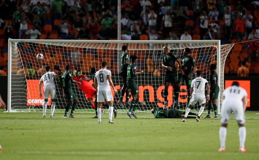 Soccer Football - Africa Cup of Nations 2019 - Semi Final - Algeria v Nigeria - Cairo International Stadium, Cairo, Egypt - July 14, 2019 Algeria&#039;s Riyad Mahrez scores their second goal from a fr ...