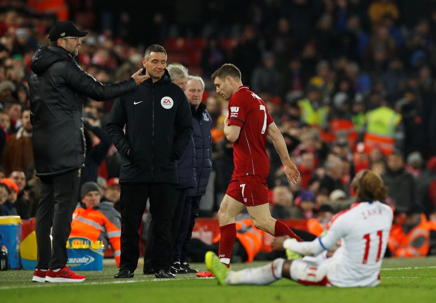 Soccer Football - Premier League - Liverpool v Crystal Palace - Anfield, Liverpool, Britain - January 19, 2019 Liverpool&#039;s James Milner walks off as he is shown a red card by referee Jonathan Mos ...