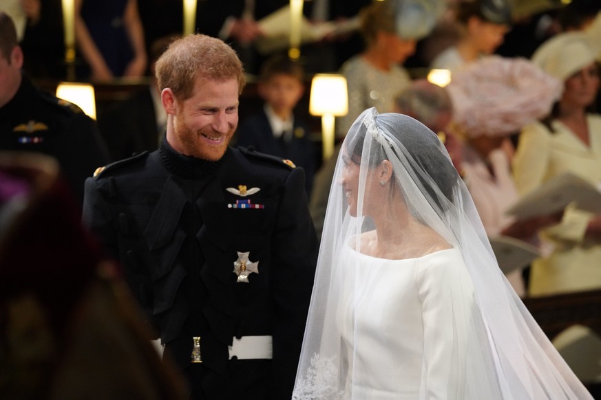 WINDSOR, UNITED KINGDOM - MAY 19: Prince Harry and Meghan Markle stand at the altar during their wedding in St George&#039;s Chapel at Windsor Castle on May 19, 2018 in Windsor, England. (Photo by Jon ...