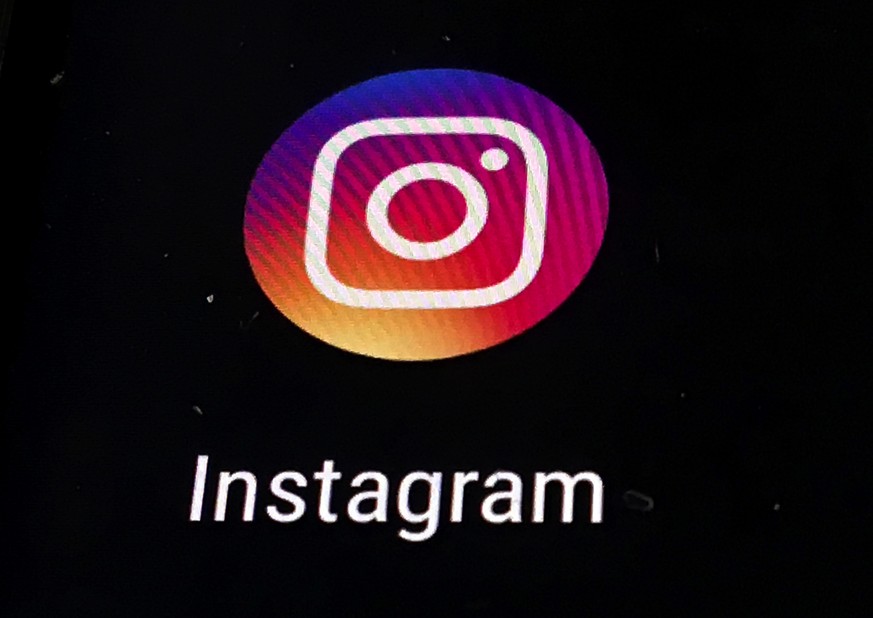 In this Thursday, Nov. 29, 2018, photo, the Instagram app logo is displayed on a mobile screen in Los Angeles. Instagram is adding a feature to make it easier to share photos and videos with fewer fol ...